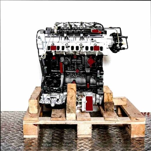 Side view of a 4HV engine on a wooden pallet against a white background. The engine features various components and connections.