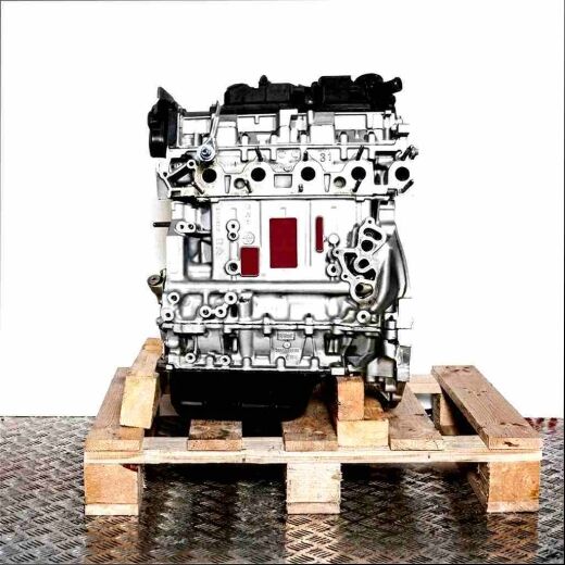Silver engine block 9HC (DV6C) with black attachments on a wooden pallet against a white background. The engine is oriented vertically.