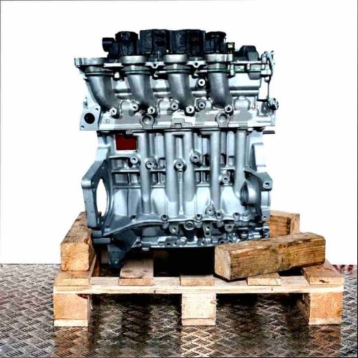 Side view of engine with code 9HX (DV6ATED4) on a wooden pallet. White background.