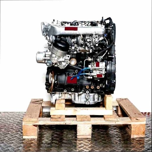 Side view of the A 17 DTR engine on a wooden pallet. The engine, featuring silver and black parts and blue hoses, is set against a white background.