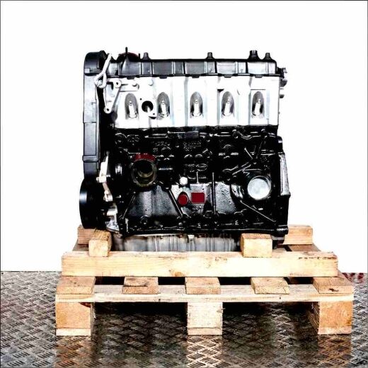 AEU engine on a wooden pallet against a white background. Vertical shot of the engine.