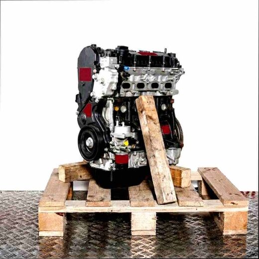 Side view of a black and silver engine AHP (DW10FUC) on a wooden pallet against a white background. A large black cover and a pulley are prominently displayed.