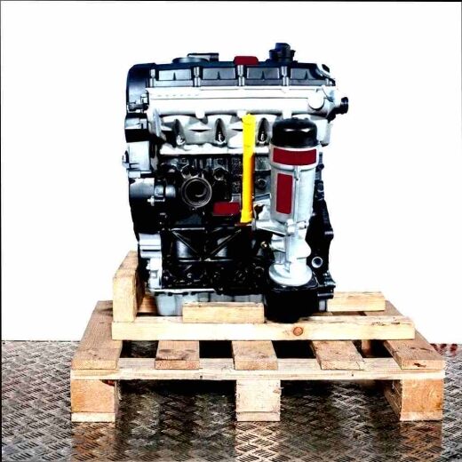 ASZ engine on a wooden pallet against a white background. Side view of the black and silver engine with yellow accents.