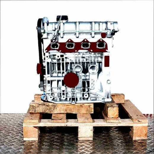 Side view of an AUB engine on a wooden pallet against a white background. The silver engine with a black oil filter and oil pan displays a timing belt with pulleys.