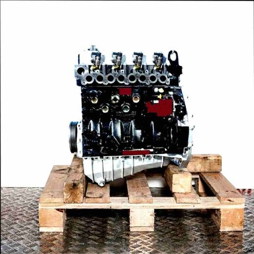 AUH engine on a wooden pallet against a white background. Side view of the black engine with silver cylinder head.