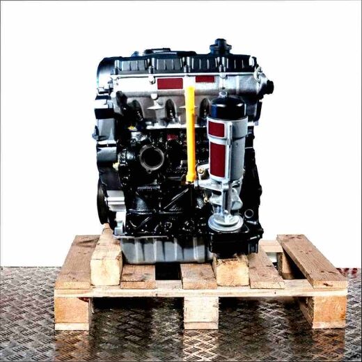 Side view of an AXR engine on a wooden pallet against a white background. The engine block, cylinder head, and components like the oil filter and dipstick are visible.