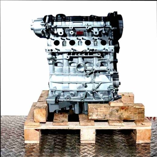 AXW engine on a wooden pallet against a white background. The cylinder block and cylinder head are clearly visible.