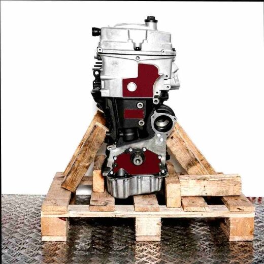 Side view of engine AYL on a wooden pallet against a white background. The engine, featuring silver and black components, is vertically oriented.