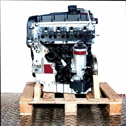 AZV engine on a wooden pallet against a white background. The black and silver engine is shown from the side.