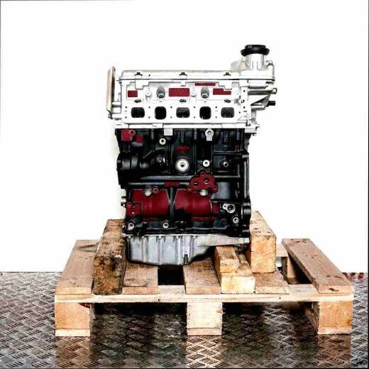 AZX engine on wooden pallet, white background. Side view of the complete engine, perfect for automotive applications.