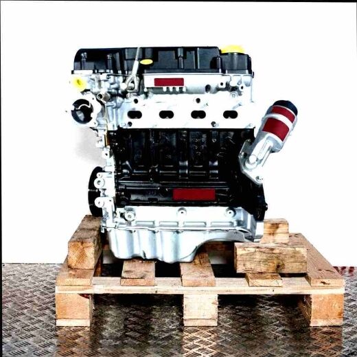 B 14 XEL engine on a wooden pallet against a white background. The silver and black engine is viewed from the side.