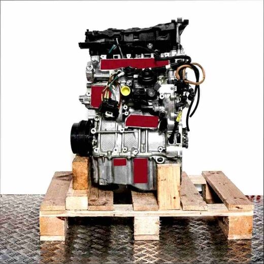 Engine B37 C15 A on a wooden pallet against a white background. This side view shows the complete engine with all attachments and cables.