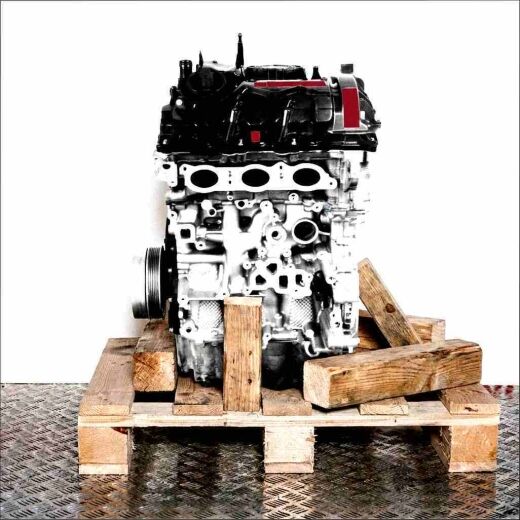 Side view of a B38 A15 A engine on a wooden pallet against a white background. The engine is vertically oriented.