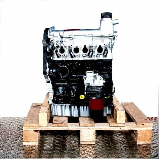Side view of a BEV engine on a wooden pallet against a white background. The silver and black engine displays features like a timing belt and oil filter.