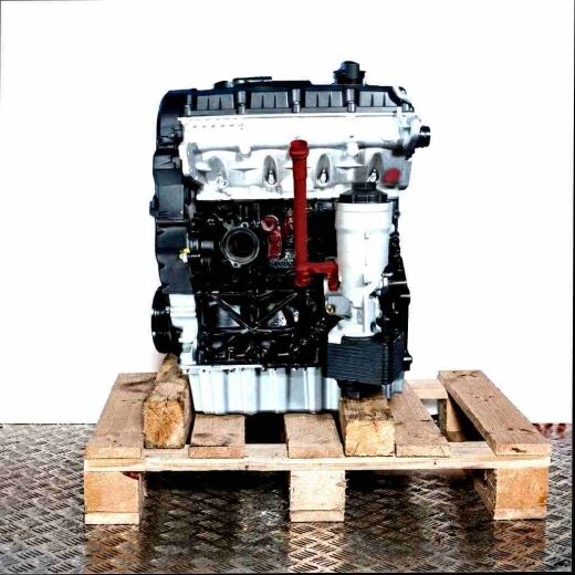 Side view of a BJB engine on a wooden pallet against a white background. The silver and black engine with a yellow oil dipstick is fully visible.