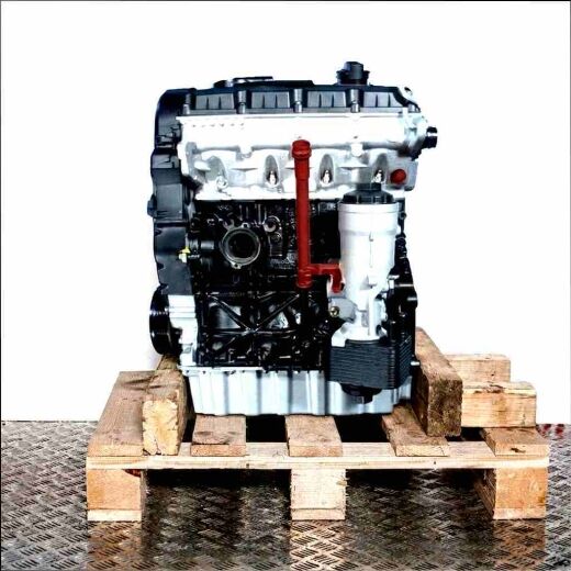 Black and silver BKC car engine on a wooden pallet against a white background. The engine, featuring a yellow oil dipstick, is shown in a flat side view.
