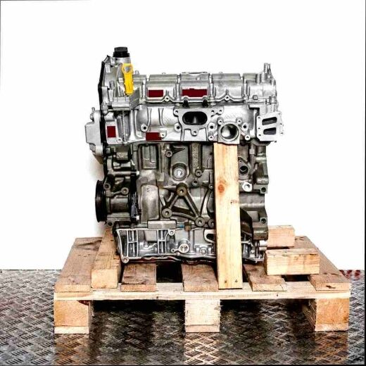BKFD engine on wooden pallet against a white background. Side view of the silver-gray engine with black elements and a yellow accent.