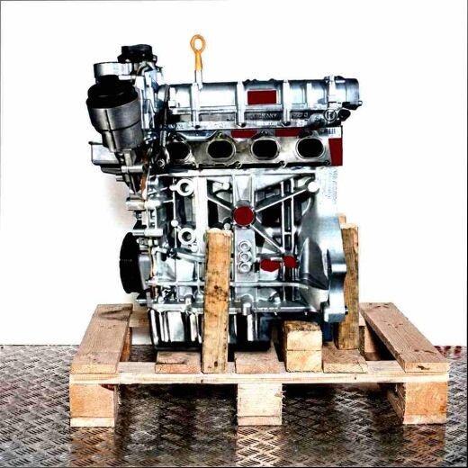 Side view of a BKG engine on a wooden pallet against a white background. The engine is vertically oriented.