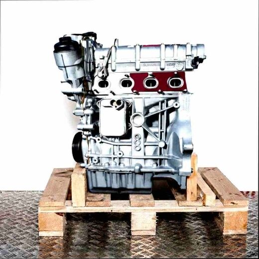 Side view of a silver BLF engine on a wooden pallet against a white background. The engine's components are clearly visible.