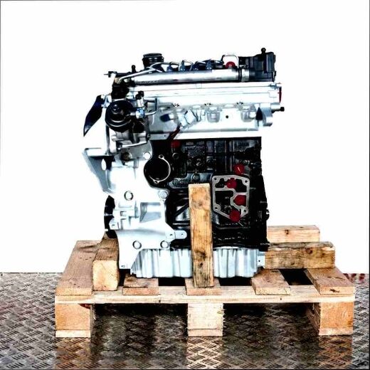BMA engine on a wooden pallet against a white background. The black and silver engine with yellow accents is vertically oriented.