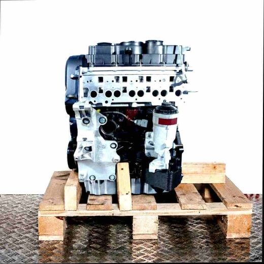 Side view of a BMR engine on a wooden pallet against a white background. The black and silver engine is vertically oriented.