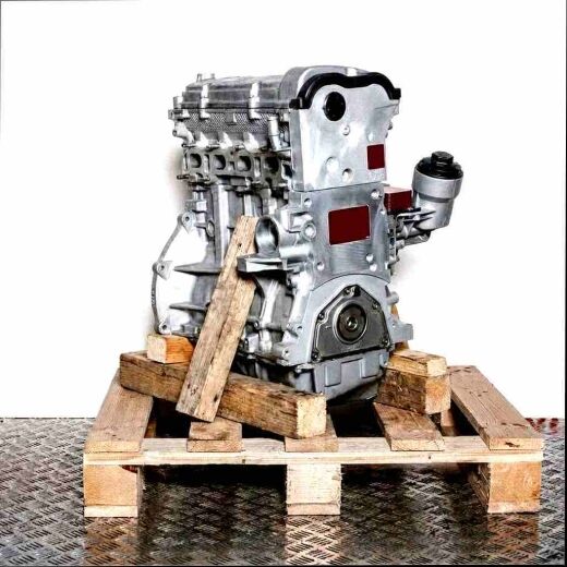 BPC engine on a wooden pallet against a white background. Side view of the silver engine, perfect for product listings.