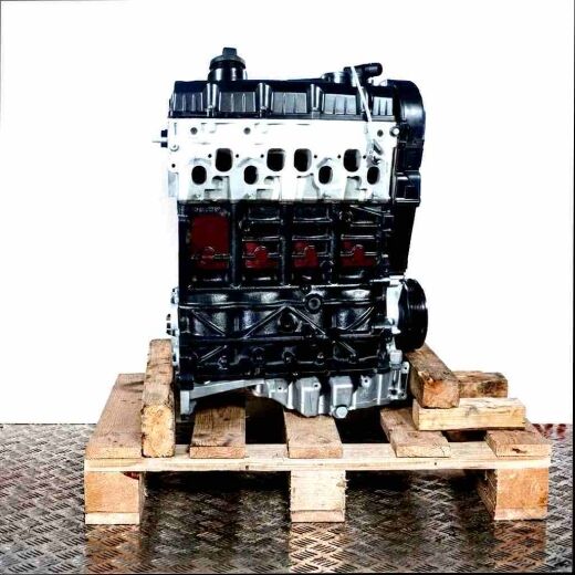 BPW diesel engine on a wooden pallet against a white background. Side view of the black and silver engine, vertically oriented.
