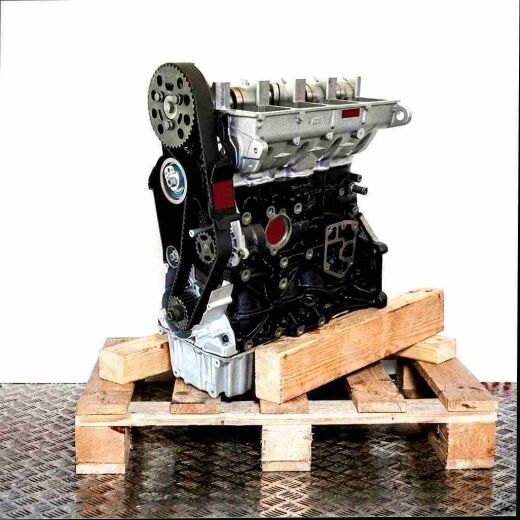 BSU engine on a wooden pallet against a white background. The black and silver engine, featuring camshafts and timing belt, is viewed from a slight angle.