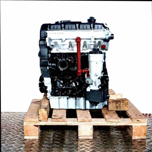 Side view of a BXE engine on a wooden pallet against a white background. The silver and black engine, featuring a yellow oil dipstick, is fully visible.