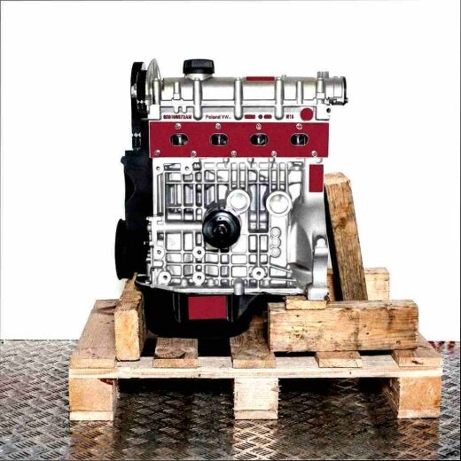 Side view of the BXW engine on a wooden pallet against a white background. The silver and black engine displays detailed surface features.