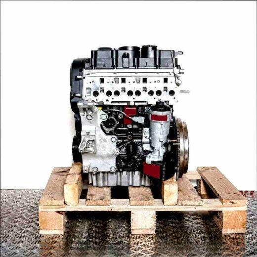 Side view of a black and silver CBBB diesel engine on a wooden pallet. The engine is set against a white background.