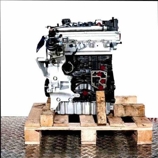 Side view of a CFGB engine on a wooden pallet against a white background. The black and silver engine with yellow accents is fully visible.