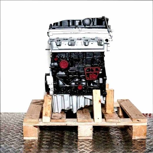 CGLD engine on a wooden pallet against a white background. The silver cylinder head and black engine block are visible.