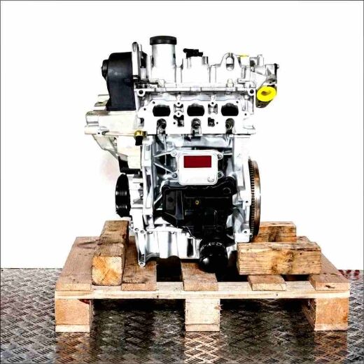 CHZC engine on a wooden pallet against a white background. The silver engine with black plastic components is vertically oriented.