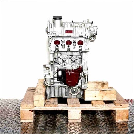 CHZJ engine on a wooden pallet against a white background. The silver engine with black parts is vertically oriented.