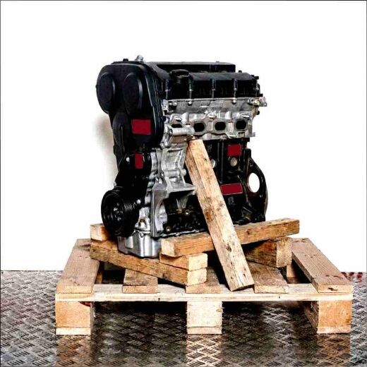 Side view of a CJAA engine on a wooden pallet. The engine is set against a white background, showcasing the timing belt cover and crankshaft pulley.