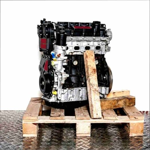 CJXE engine in black and silver on a wooden pallet against a white background. The engine, with yellow accents, is viewed from the side.