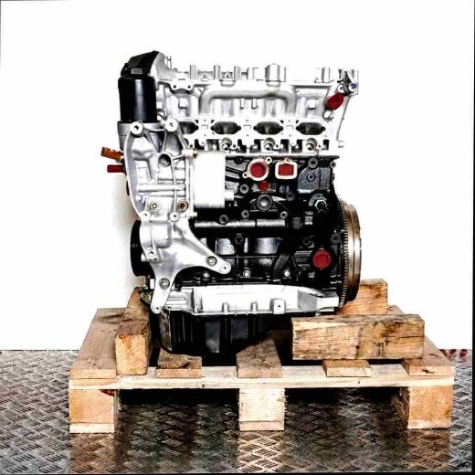 CNCB engine on a wooden pallet against a white background. This image displays the black and silver engine from a side, slightly angled front view.