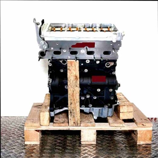 Side view of a CNHA engine on a wooden pallet against a white background. The engine, featuring black and silver components, is vertically oriented.