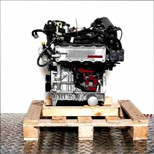 CPWA engine on a wooden pallet against a white background. Side view of a modern combustion engine.