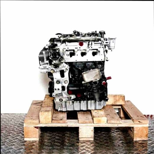 Side view of a CRMB engine on a wooden pallet against a white background. The engine is black, silver, and has yellow accents.