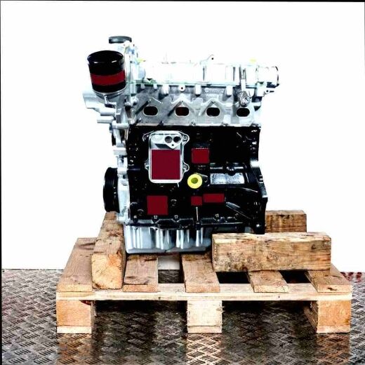 CTHG engine on wooden pallet, white background. Silver and black car engine, side view.