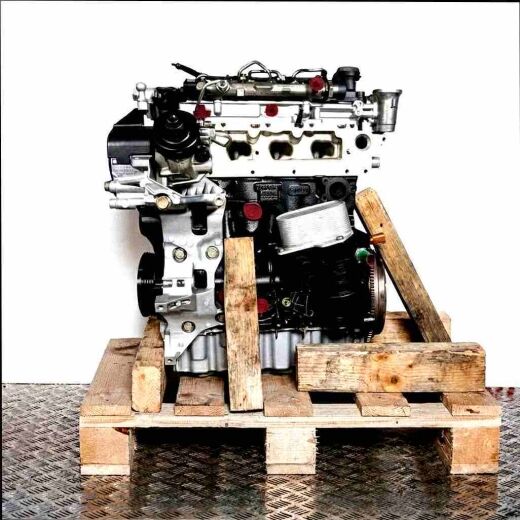 Side view of a CUPA engine on a wooden pallet. The engine is black and silver with yellow accents, set against a white background.