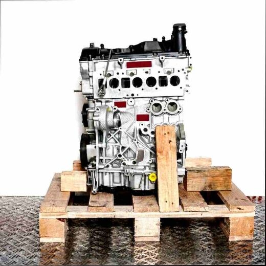 CUTA engine on a wooden pallet against a white background. Yellow caps are visible. The engine is fully displayed.