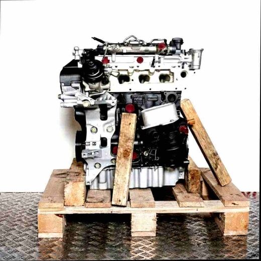 Side view of a CUWA engine on a wooden pallet against a white background. The engine is predominantly black and silver with yellow accents.