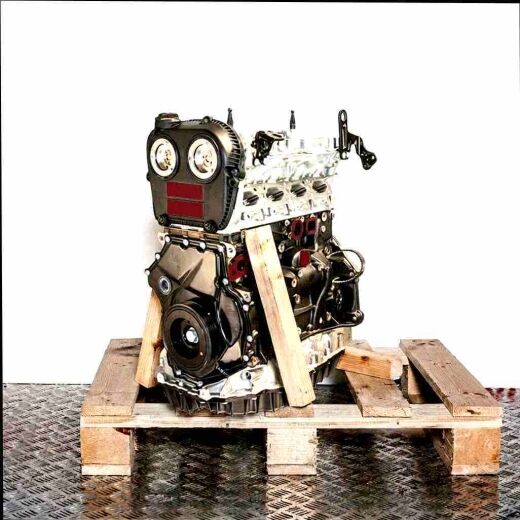 CXCA engine on a wooden pallet against a white background. Side view of the black and silver engine.