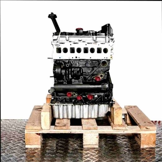 Side view of the CXEC engine on a wooden pallet against a white background. The engine is black and silver with yellow accents.
