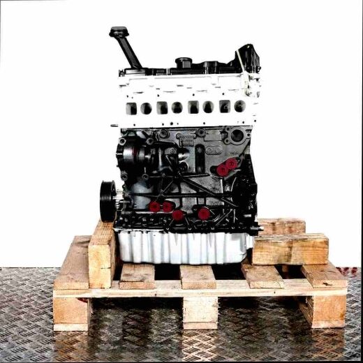CXHC engine on a wooden pallet against a white background. The silver top and black bottom of the engine are visible, along with yellow caps. Vertical shot.