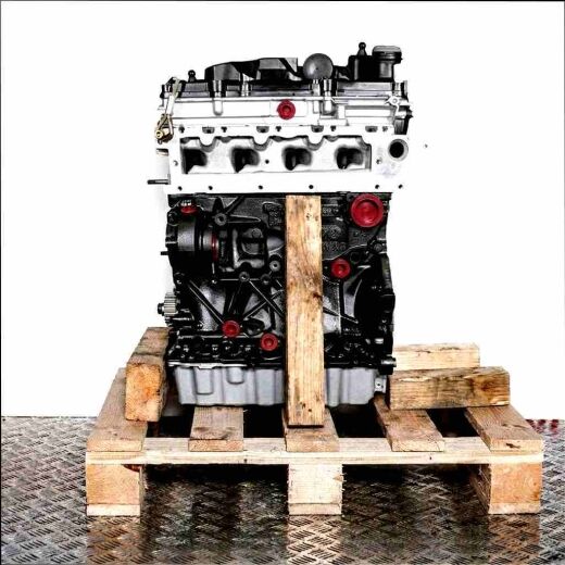 CXXB engine on a wooden pallet against a white background. The black engine block with a light gray top features yellow markings. Side view.