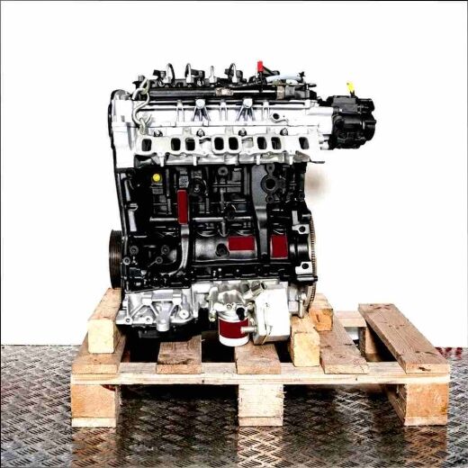 Side view of a black and silver CYFA engine on a wooden pallet. The engine is set against a white background.